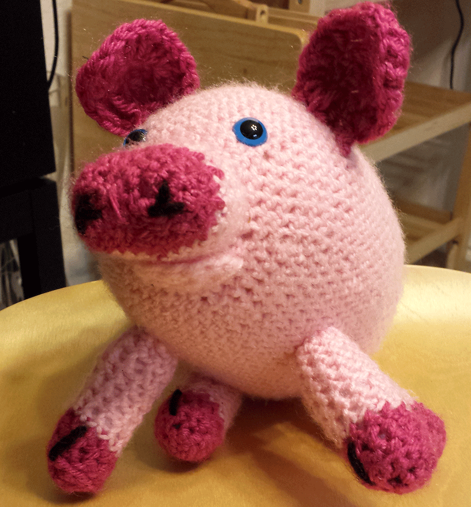Picture of a crocheted stuffed animal as a pig