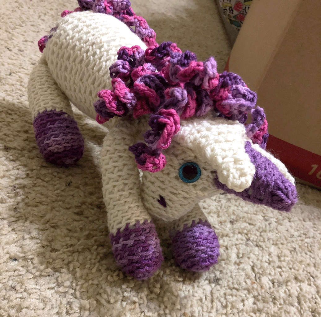 Picture of a crocheted stuffed animal as a unicorn